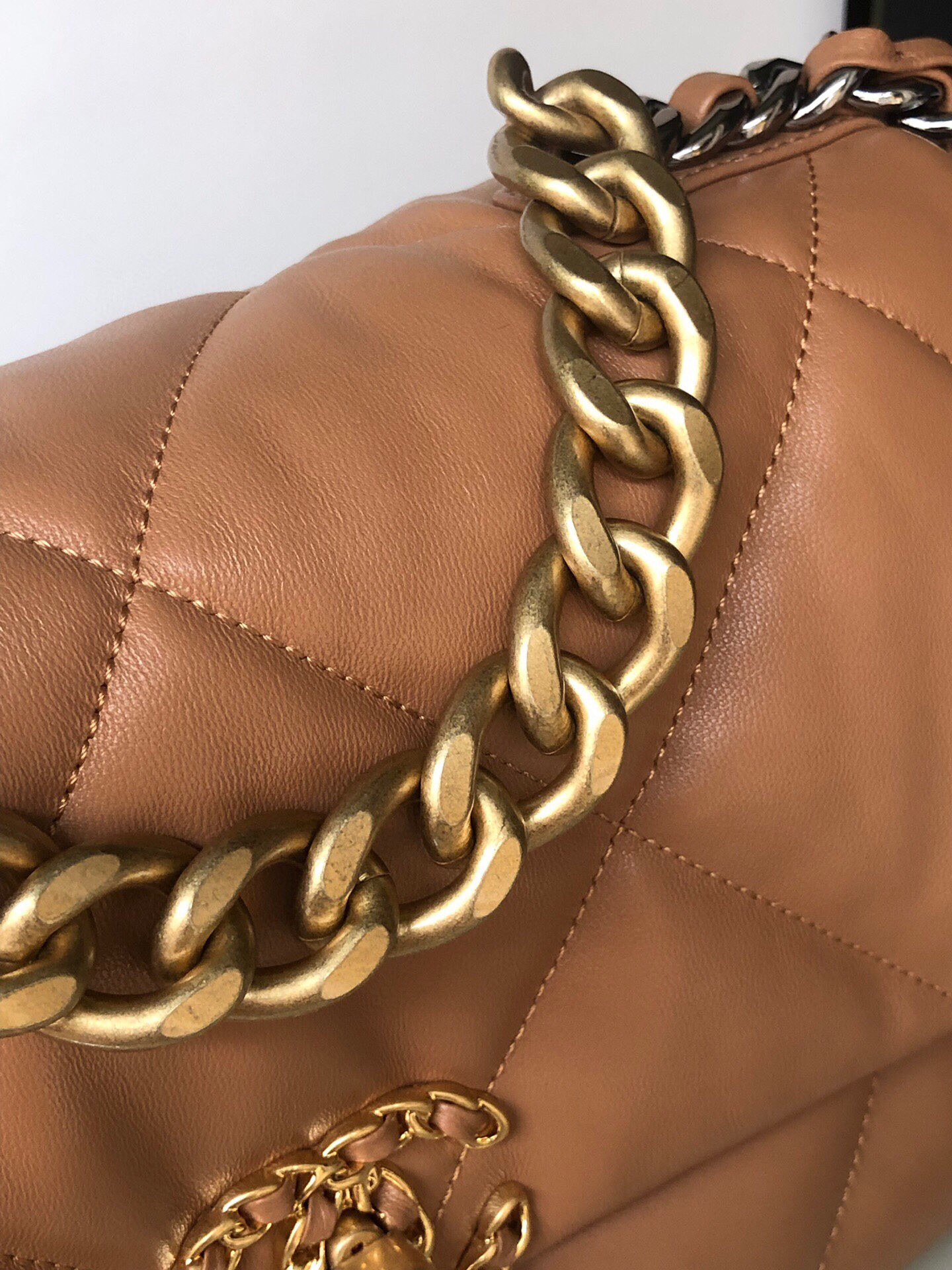 Ch*el 19 large handbag shiny leather, gold-tone, silver-tone & ruthenium-finish metal caramel 7.8 × 11.7 × 3.9 in