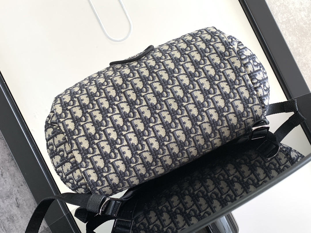 D*or 8 backpack with flap beige and black D*or oblique jacquard 31 x 48 x 16.5 cm